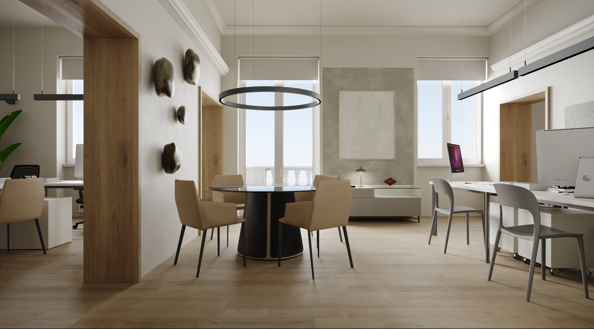 Sala riunioni con tavolo tondo nero e pendant ad anello