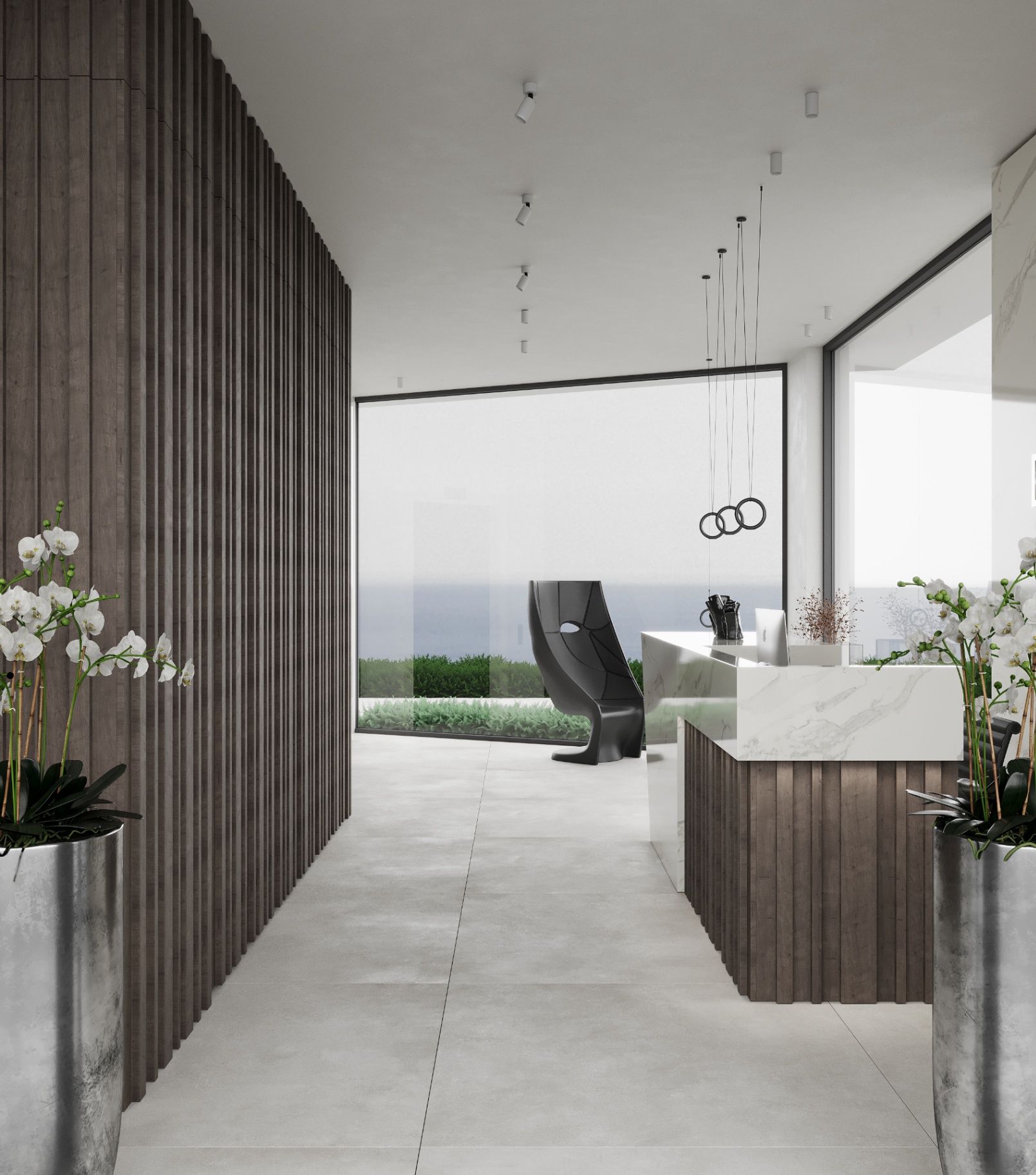 Hall con boiserie a listelli verticali e reception in marmo